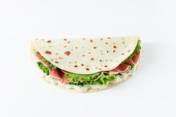 Italian street food flat lay with piadina isolated on a white background.  Piadina romagnola -...