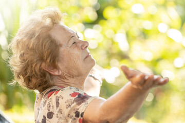 senior woman breathing happy outdoors