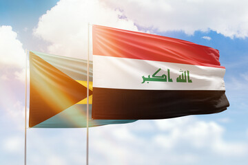 Sunny blue sky and flags of iraq and bahamas