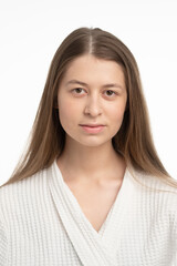 Fototapeta premium Portrait of beautiful woman. Female skin care. Healthy long natural hair and beauty skin. Moisturizer cream and eye patches.