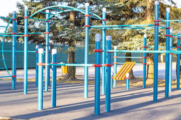 stationary outdoor exercise equipment in a public park. public urban space for sports.