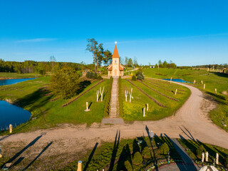 Fototapeta premium Christ the King Hill Sculpture Park, Aglona, Latvia. A beautiful nature park made of wooden sculptures in honor of God.