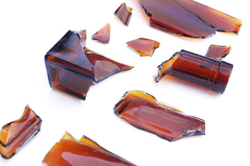 Parts of a broken bottle on a white background