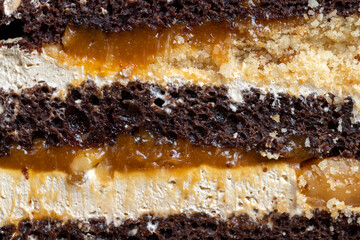 caramel cake with peanuts and buttercream, close up