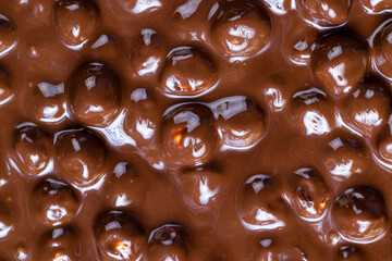 real milk chocolate while cooking with hazelnuts