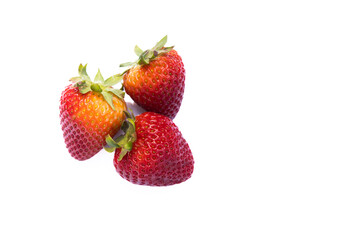 Three strawberries on white