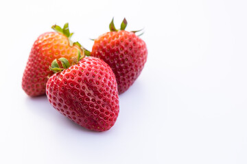 Three strawberries on white