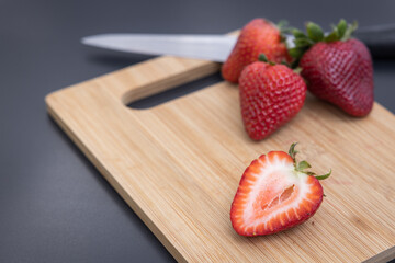 sliced strawberry on wood