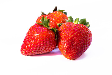 Three strawberries on white