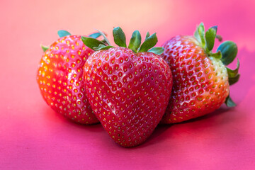 Strawberries on red