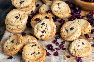 delicious dried cookies made of high-quality flour with dried red cranberries on the table