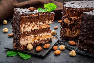 Delicious caramel chocolate tart, topped with nuts and hazelnuts, almonds
