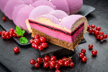 Pink mousse cake with cloud berries.