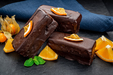 Delicious chocolate cakes on table close-up