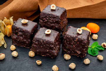 Delicious chocolate brownie with nuts on the table.