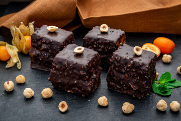 Delicious chocolate brownie with nuts on the table.