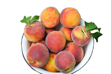 Plate with fruit peaches or nectarines on a white background