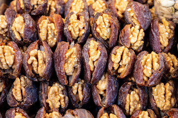 Turkish or arabic sweet dessert, ripe dried dadels with walnuts sweetened with syrup or honey.