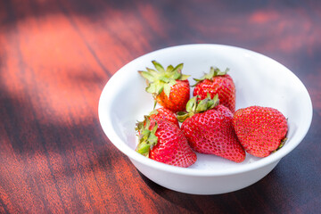 Fresh organic strawberries in a bowl