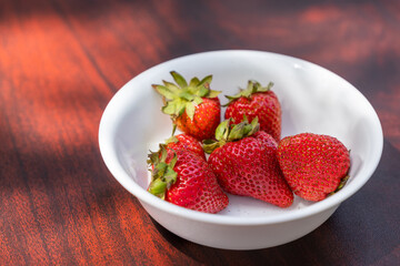 Fresh organic strawberries in a bowl