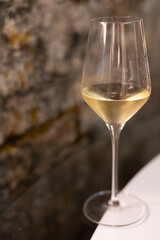 Tasting of brut champagne sparkling wine produced by traditional method in underground caves