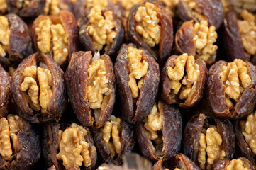 Turkish or arabic sweet dessert, ripe dried dadels with walnuts sweetened with syrup or honey.