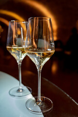 Tasting of brut champagne sparkling wine produced by traditional method in underground caves