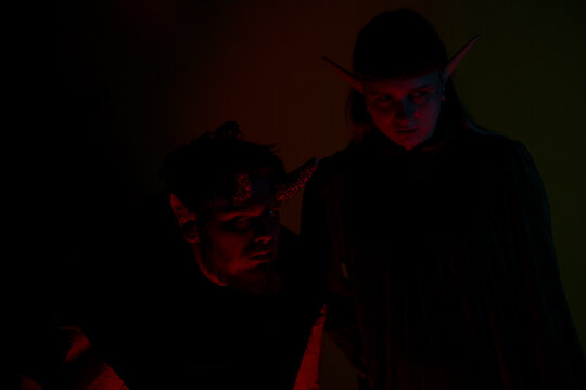 A devil and elf in the dark