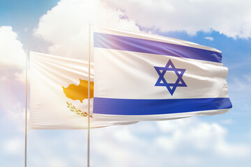 Sunny blue sky and flags of israel and cyprus