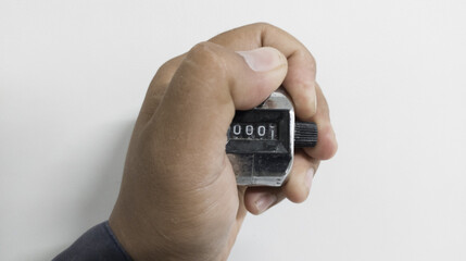 Hand held tally counter isolated on white background