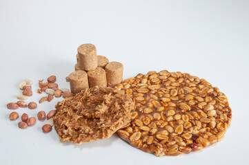 Paçoca, pé de moleque , cocada and peanut on a white background
