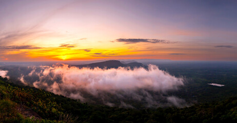 Panorama Beautiful Clouds and fog above mountain, beautiful morning sunshine landscape at Pha Mo i Daeng Phra Wihan National Park. Sisaket province,Thailand,ASIA.