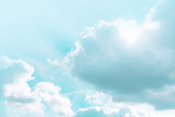  Heaven background. Clouds and sunshine. White clouds and sun rays in a light blue sky.Beautiful heavenly wallpaper in blue tones