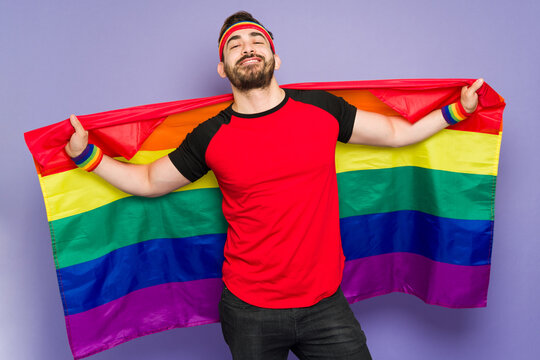 Attractive queer man on the pride parade
