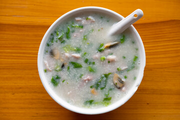 top view porridge with pork and preserved egg