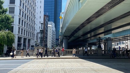 Tokyo city landscape / cityscape, Nihonbashi Tokyo Japan, the highway over the historic bridge, completed in 1911, the daily scenery of pedestrians and the surrounding buildings, shot taken on year 20