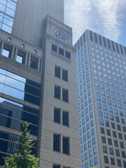 Obraz premium The glass architectural closeup of central downtown Tokyo modern buildings, year 2022 June 13th, sunny weekeday