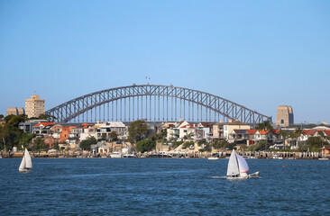 Cityscape with a bridge of the bay, small boats on a water, Sydney, Australia