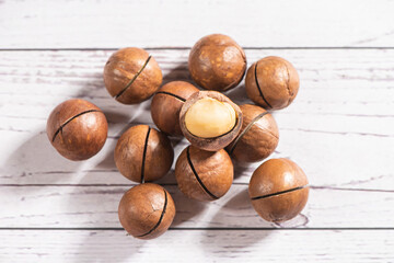 Macadamia nuts on wooden table