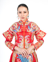 Portrait of a young asian Chinese female lady model wearing red traditional vintage wedding costume smiling and posing with different poses and gestures 