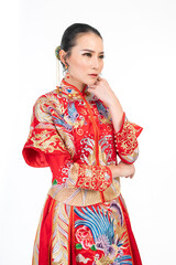 Portrait of a young asian Chinese female lady model wearing red traditional vintage wedding dress costume smiling and posing with different poses and gestures 