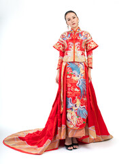 Portrait of a young asian Chinese female lady model wearing red traditional vintage wedding dress costume smiling and posing with different poses and gestures 