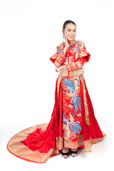 Portrait of a young asian Chinese female lady model wearing red traditional vintage wedding dress costume smiling and posing with different poses and gestures 