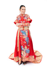 Portrait of a young asian Chinese female lady model wearing red traditional vintage wedding dress costume smiling and posing with different poses and gestures 