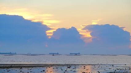 Sunset beach landscape, sea horizon at sunset, dramatic sunset colour.