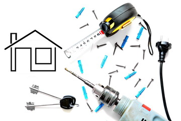 Concept of construction works of house. Construction roulette, drill screwdriver with electric cable with plug and screws, key to apartment on white background with copy space and image of the house