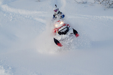 Alaska snowmachine rider in Alaskan backcountry