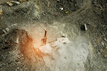 aerial view of excavator scooping rocks