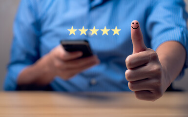 Customer satisfaction concept. Hand with thumb up Positive emotion smiley face icon and five star with copy space. 5 star satisfaction, Excellent business rating experience
