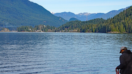 Burrard Inlet as seen from Inlet Park at Burnaby, BC, with forested mountain backdrop.